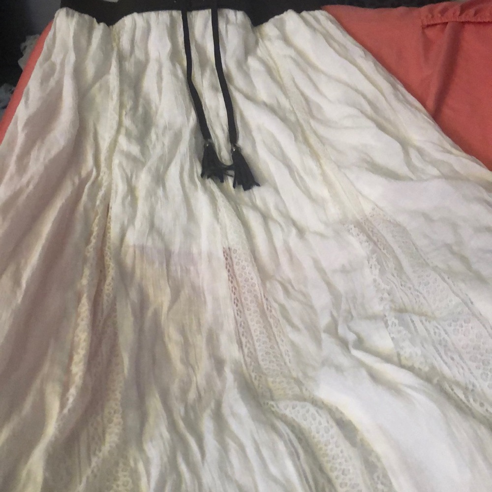 White skirt with brown belt